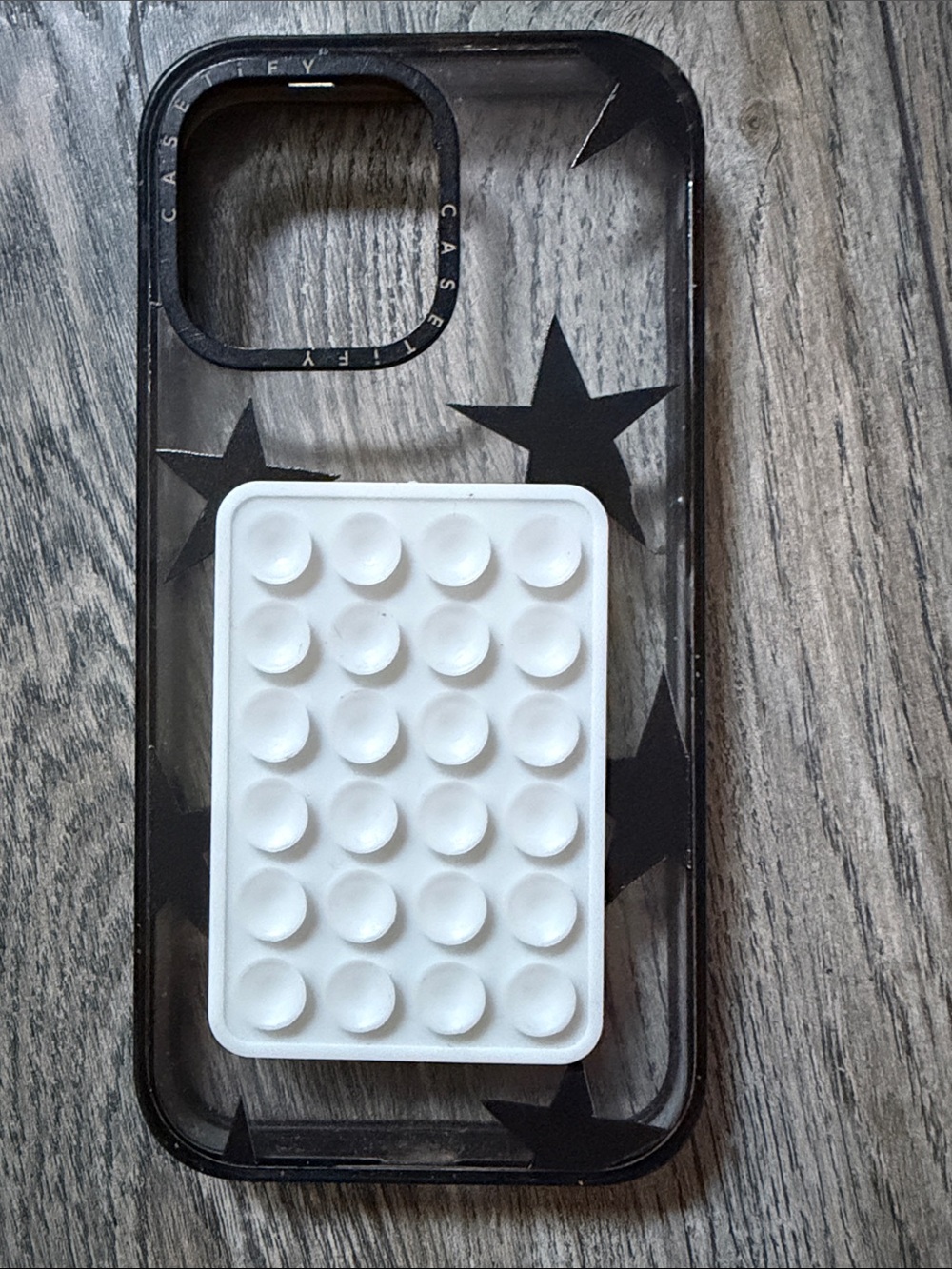 Casetify Clear Case with Black Star Design and White PopGrip